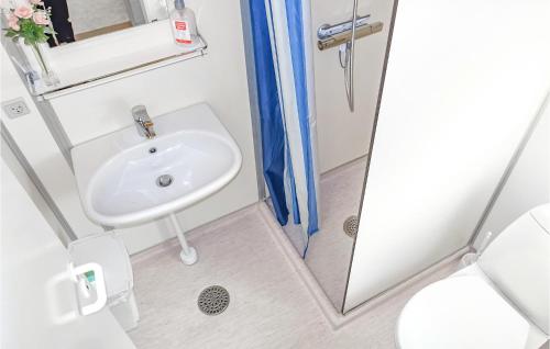 a bathroom with a sink and a shower at Lovely Home In Nex With Wifi in Neksø