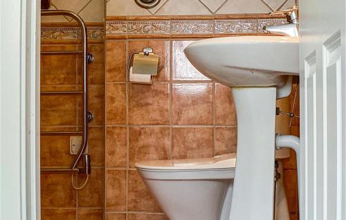 a bathroom with a sink and a toilet at Lovely Home In Visby With Wifi in Visby