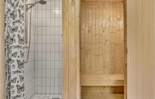 a bathroom with a shower with a shower curtain at Nice Home In Humble With Sauna in Humble