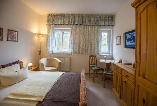 En eller flere senge i et værelse på Kurhotel Bad Suderode