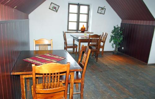 a dining room with a table and chairs at Guesthouse Carl Schmidt in Põltsamaa