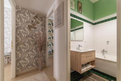 a bathroom with a shower and a sink and a tub at Vatican Corner Family Apartment in Rome