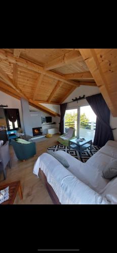 a large room with two beds and a living room at BEACH HOUSE ZECJA in Poljica