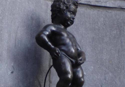 a bronze statue of a young boy holding a cord at BEST WESTERN Hotel Brussels South in Ruisbroek