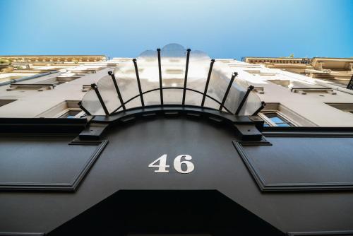 a building with the number on it at Hotel George - Astotel in Paris