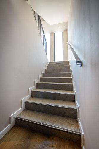 a staircase in a building with a stair case at Vila Sarisa in Deva