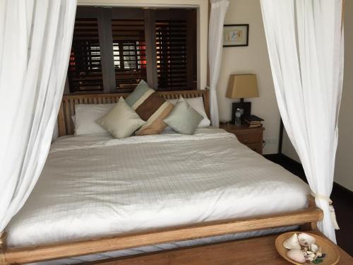 Ένα ή περισσότερα κρεβάτια σε δωμάτιο στο Driftwood Villa