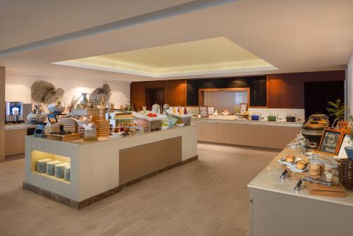 a large room with a counter in a store at Radisson Hotel Colombo in Colombo