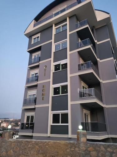 a tall building with balconies on the side of it at 2 Zimmer Apartment in Avsallar in Alanya