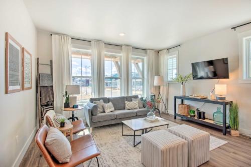 a living room with a couch and a table at Cozy Montana Retreat with Patio Near Parks! in Billings