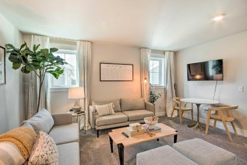 a living room with a couch and a table at Cozy Montana Retreat with Patio Near Parks! in Billings