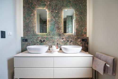 a bathroom with two sinks and two mirrors at Apartment Adriatic Pearl -NEW 2023- in Tučepi