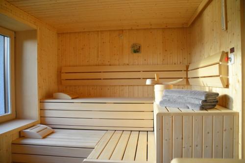 a sauna with two beds and towels in it at Gasthof zur Donaubrücke in Ardagger Markt