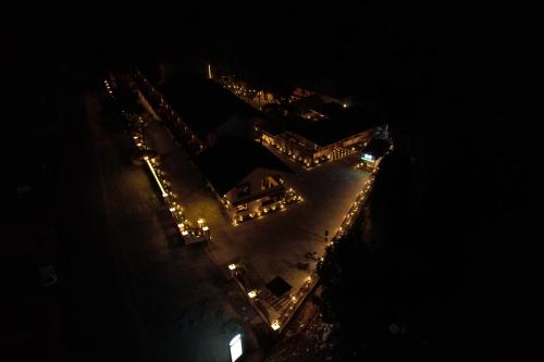 an overhead view of a beach at night with lights at Aananda Wellness and Resorts in Dharmastala