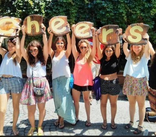 a group of girls holding up their hats at Cheers in Evander