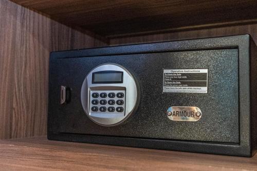 a microwave oven sitting on top of a shelf at Nanu Beach Resort & Spa in Betalbatim