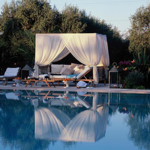 a canopy over a swimming pool with at Tenuta Centoporte in Otranto