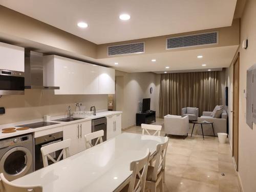 A kitchen or kitchenette at Mangroovy - 2BR La Blanca Pool View