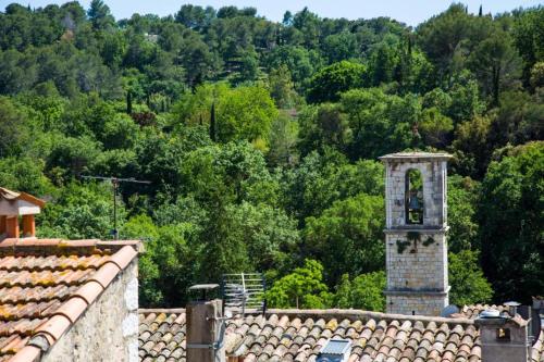 a clock tower on the roof of a building at Hotel les Armoiries in Valbonne