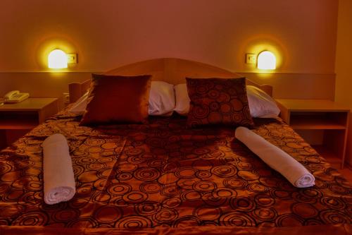Postel nebo postele na pokoji v ubytování Hotel Art