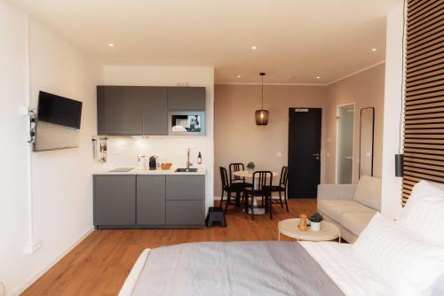 Ένα ή περισσότερα κρεβάτια σε δωμάτιο στο NUVA Apartments - Friesenplatz