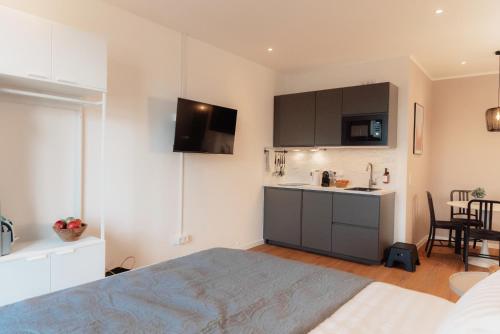 Ένα ή περισσότερα κρεβάτια σε δωμάτιο στο NUVA Apartments - Friesenplatz