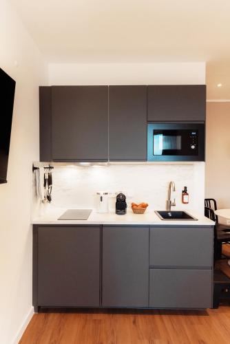 Η κουζίνα ή μικρή κουζίνα στο NUVA Apartments - Friesenplatz