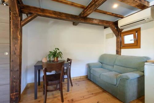 a living room with a couch and a table at El Encanto in Monachil