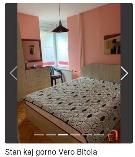 a bedroom with a bed in a room with pink walls at Apartment Sivakov in Bitola