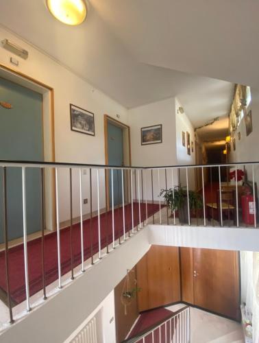 a view from the top of a staircase in a building at Hotel Villa Emilia in Ortisei