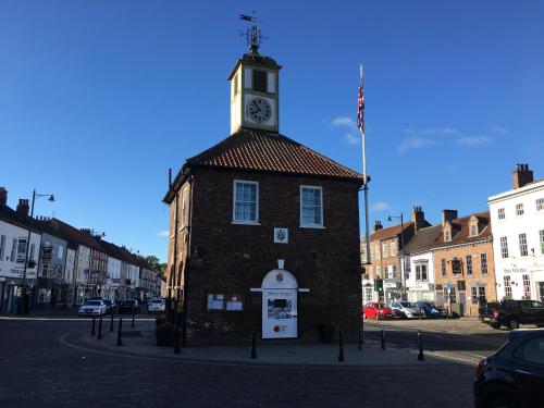 a building with a clock tower on top of it at White House Barn, near Yarm / Stockton-on-Tees in Yarm