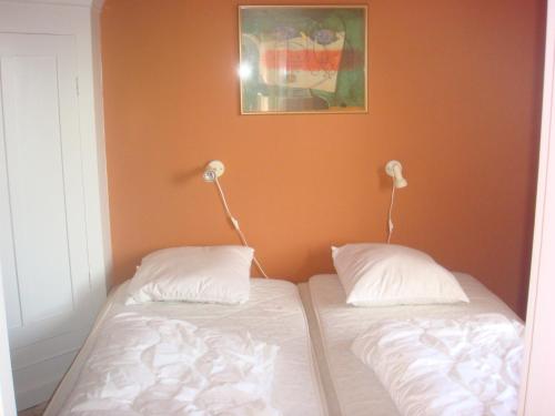 En eller flere senge i et værelse på Penthouse Apartment Downtown - Hotel Sønderstrand Apartments