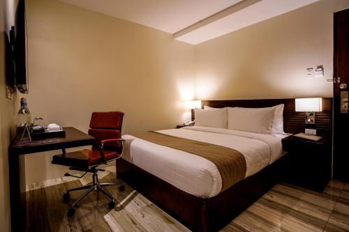 Una cama o camas en una habitación de Hotel Areca