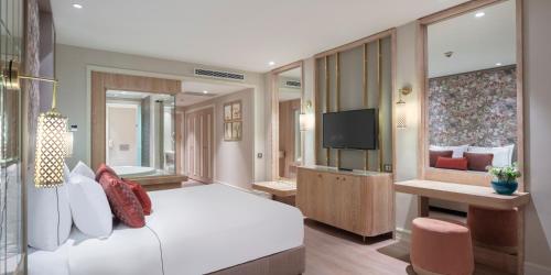 En eller flere senge i et værelse på Ela Excellence Resort Belek