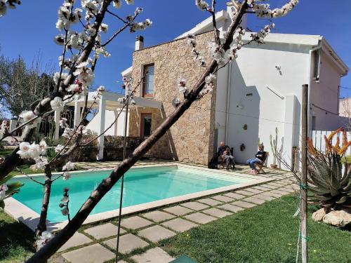 a house with a swimming pool in a yard at Casa Lucrezia in Villa Gorizia
