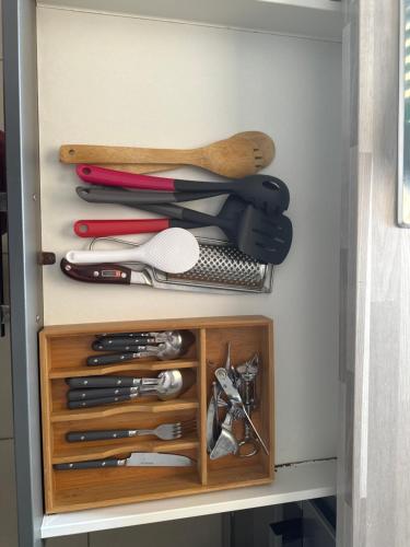 a drawer with a bunch of cooking utensils at Mana - SRFB 2 in Mana