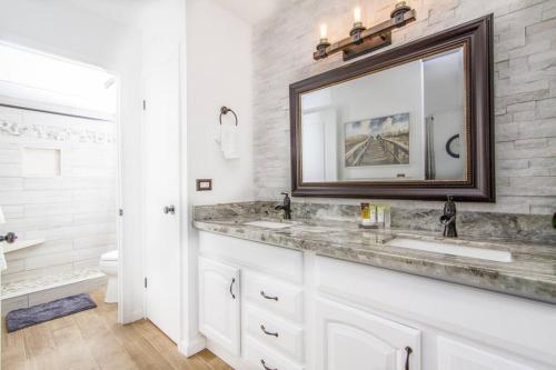 a bathroom with a sink and a mirror at Hawaiian Hospitality in Honolulu