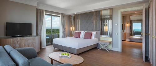 En eller flere senge i et værelse på Ela Excellence Resort Belek