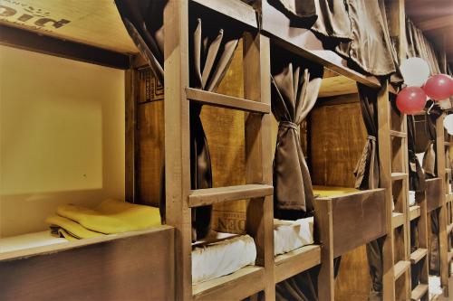 a room with wooden bunk beds with balloons at ASRA DORMITORY For Male And Female in Mumbai