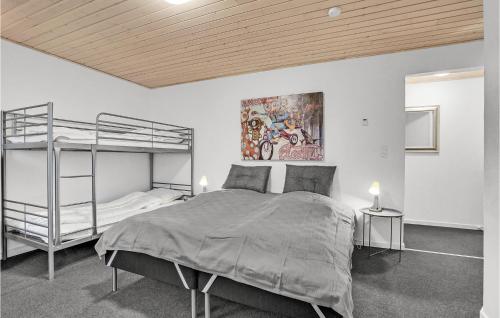 a bedroom with a bunk bed and a ladder at Stunning Apartment In Billund With Kitchen in Billund
