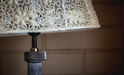 a lamp with a shade on top of it at Réva Residences and Pool in Monforte dʼAlba