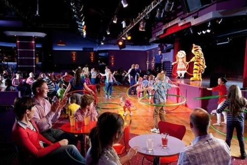 a group of people watching a show on a stage at Atlas By The Sea - Craig Tara, Ayr in Ayr