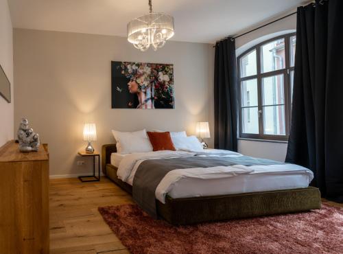 a bedroom with a large bed and a window at Suite Home Apartments in Weimar