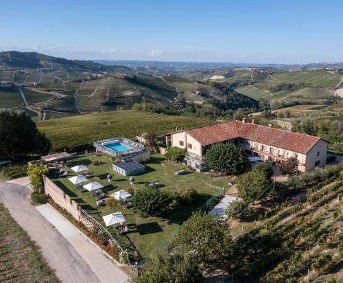 an aerial view of a house in a vineyard at Amalia Cascina in Langa in Monforte dʼAlba