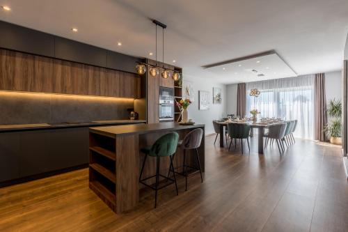 a kitchen and dining room with a table and chairs at Villa Argola in Split