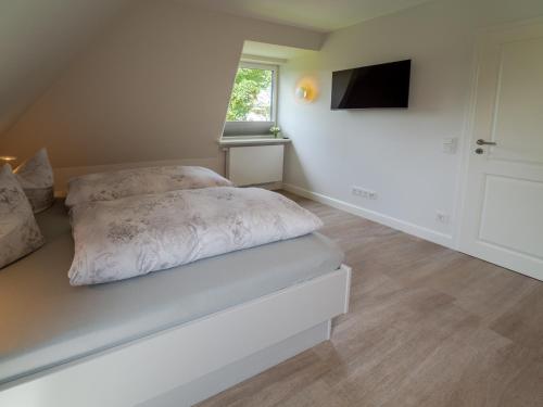 Postel nebo postele na pokoji v ubytování Ferienwohnung Sarnade
