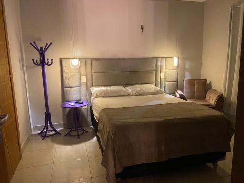 En eller flere senger på et rom på Casa Confortável