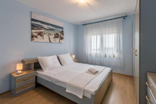 Posteľ alebo postele v izbe v ubytovaní Apartman Bella Vita