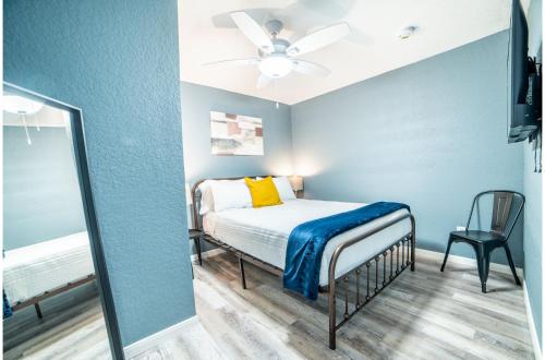 a bedroom with a bed and a mirror at Fascinating 2BR1BA Near Festive DT and Riverwalk in San Antonio