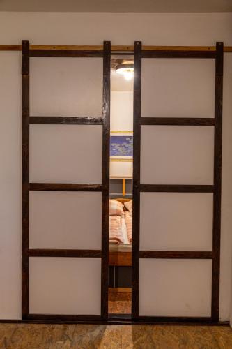 Ένα ή περισσότερα κρεβάτια σε δωμάτιο στο Apartmani Papeš